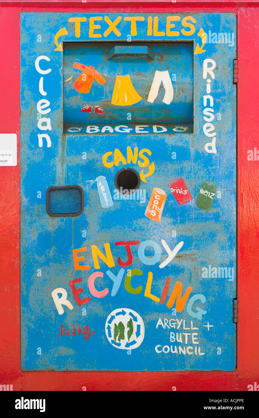 Colourful recycling receptacle for textiles and cans at Stock Photo