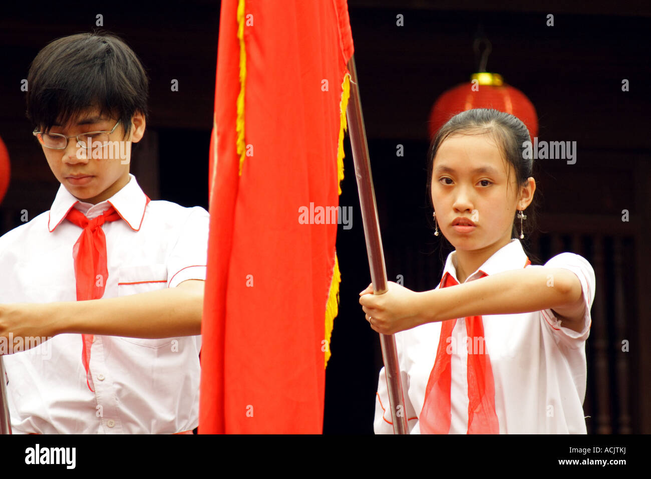 Young girl holding a flag during an orchestra´s function in Hanoi, Vietnam Stock Photo