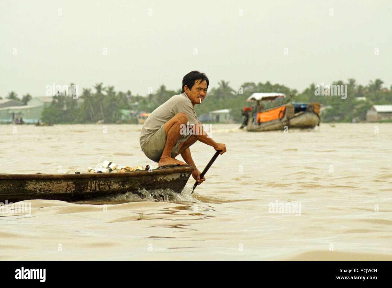 Man on a boat in Mekong-Delta, Vietnam Stock Photo - Alamy