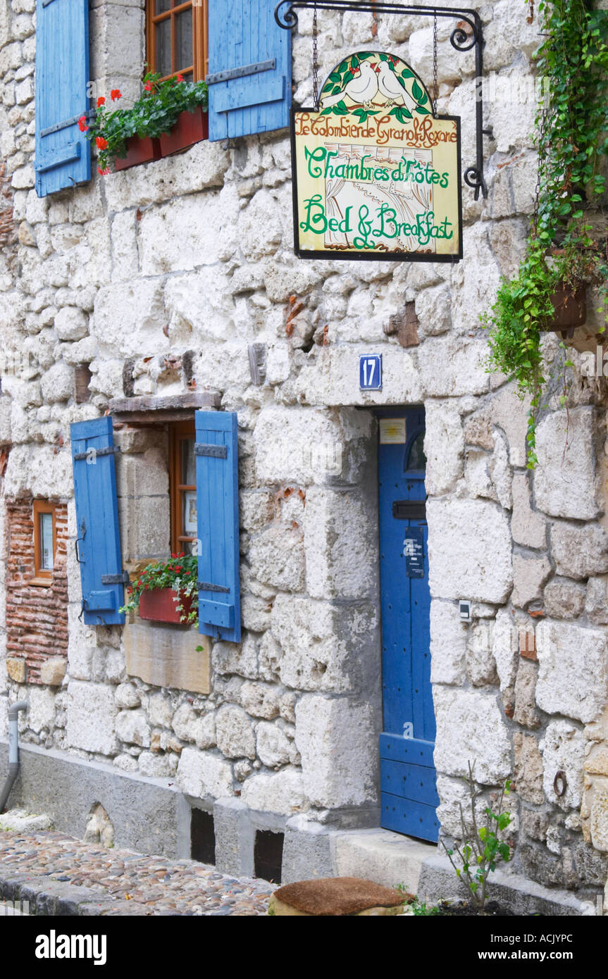 A cobble stone street in the old town with charming character-full old stone houses, sign saying Le Colombier de Grando and Roxane Bed and Breakfast on Place de la Myrpe, facing Place du Docteur Cayla Square Bergerac Dordogne France Stock Photo