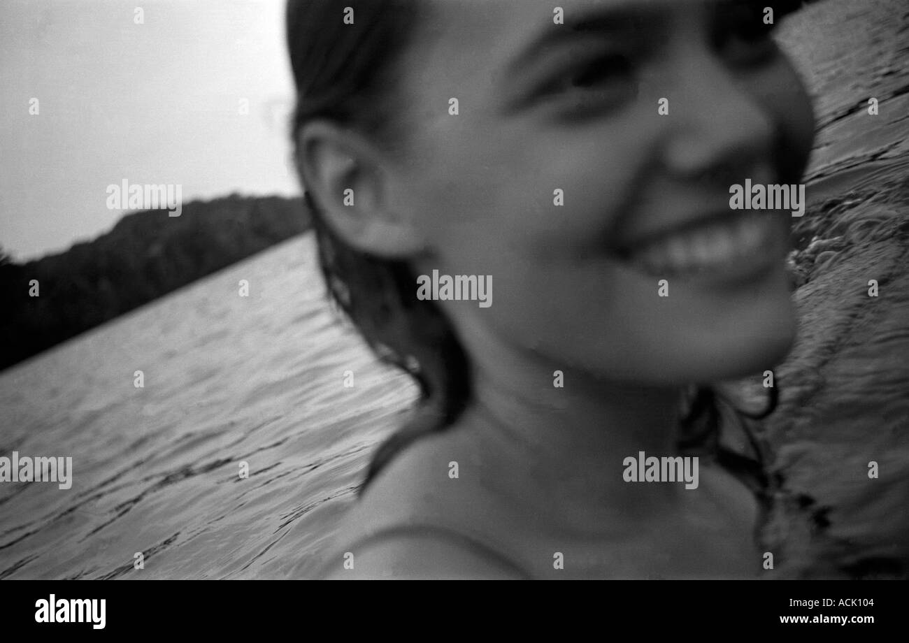 A young woman swimming in a lake Stock Photo