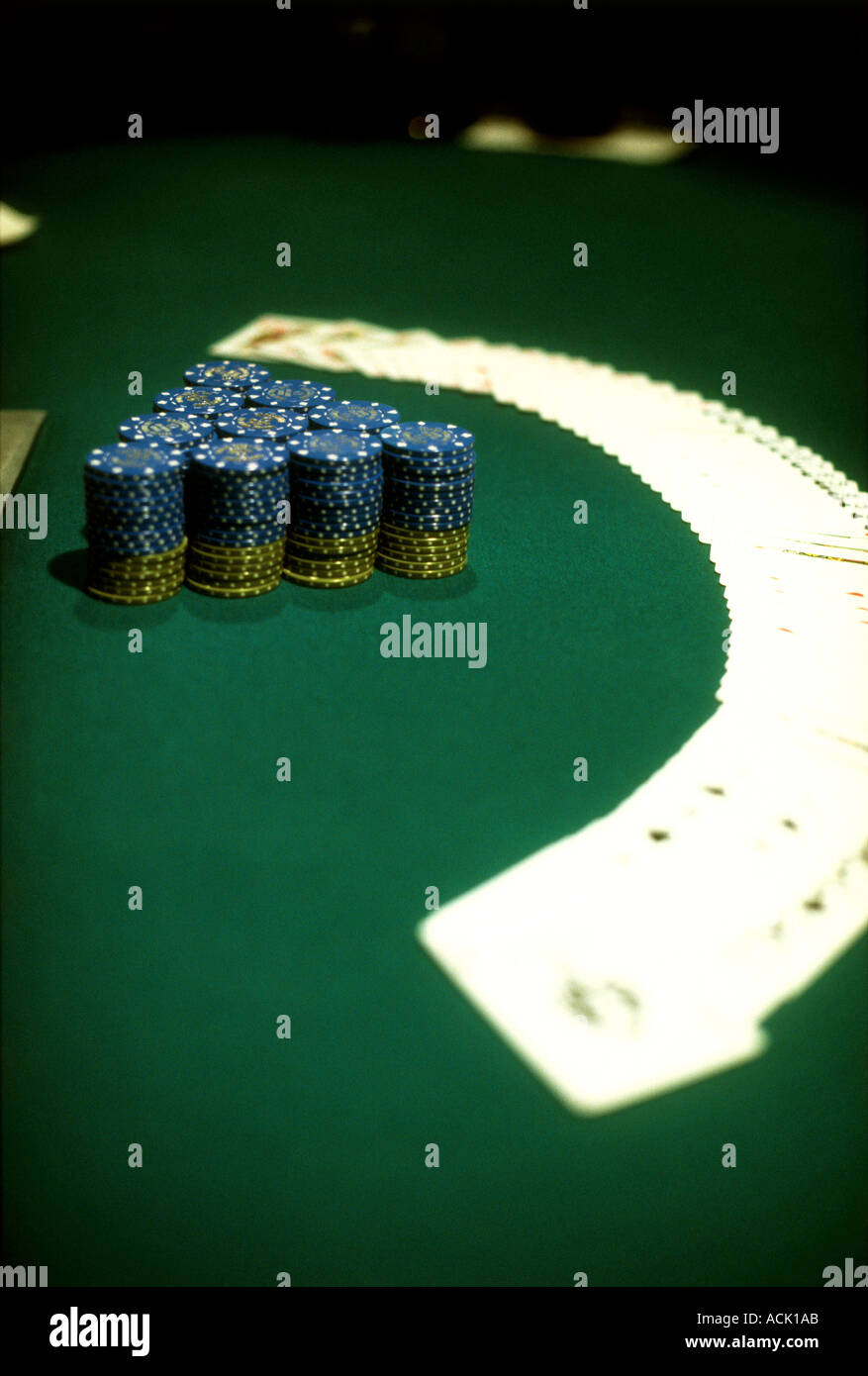 chips and cards spread out on a casino table Stock Photo