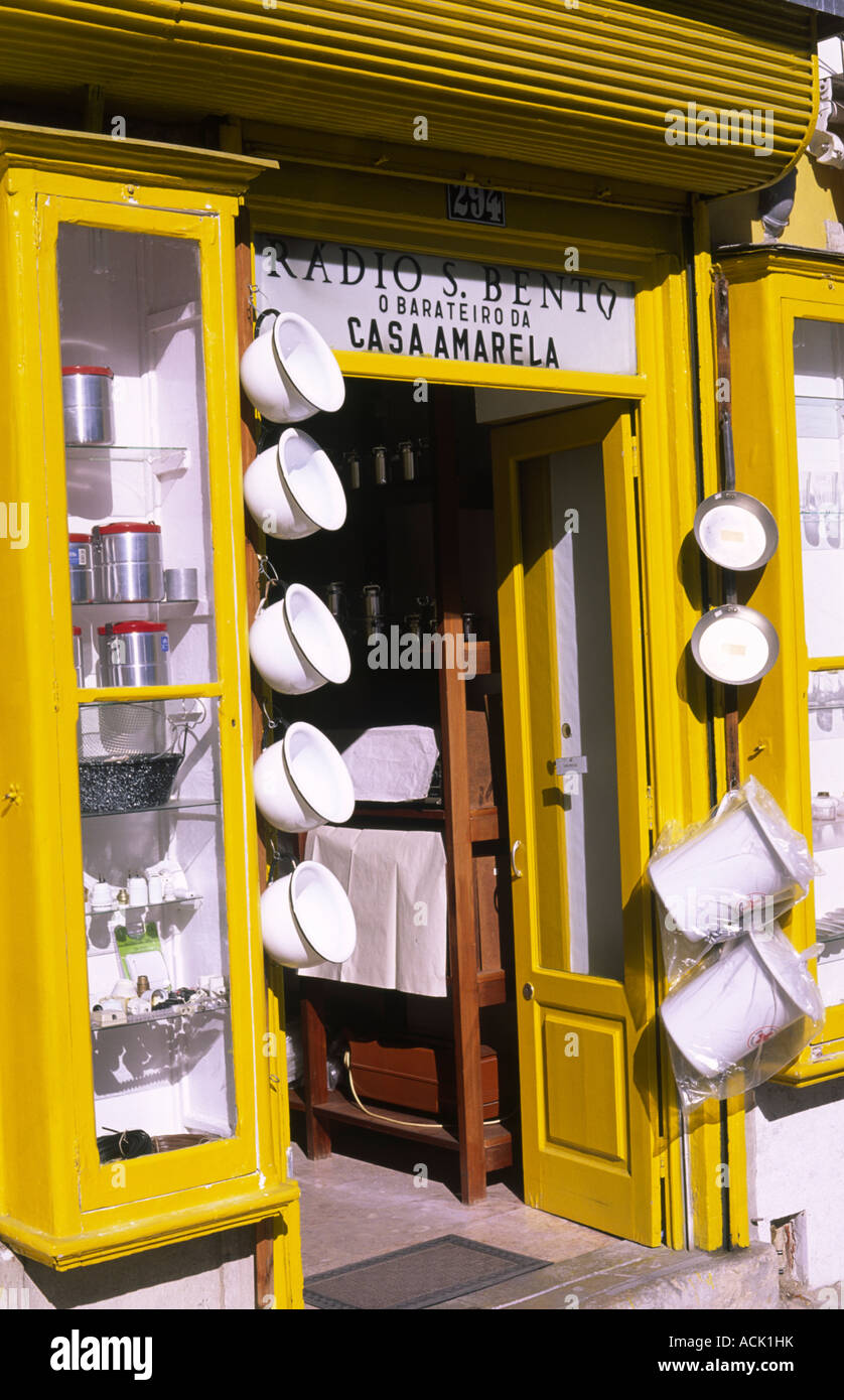 Canary yellow shop with pots and pans at São Bento Street, Lisbon