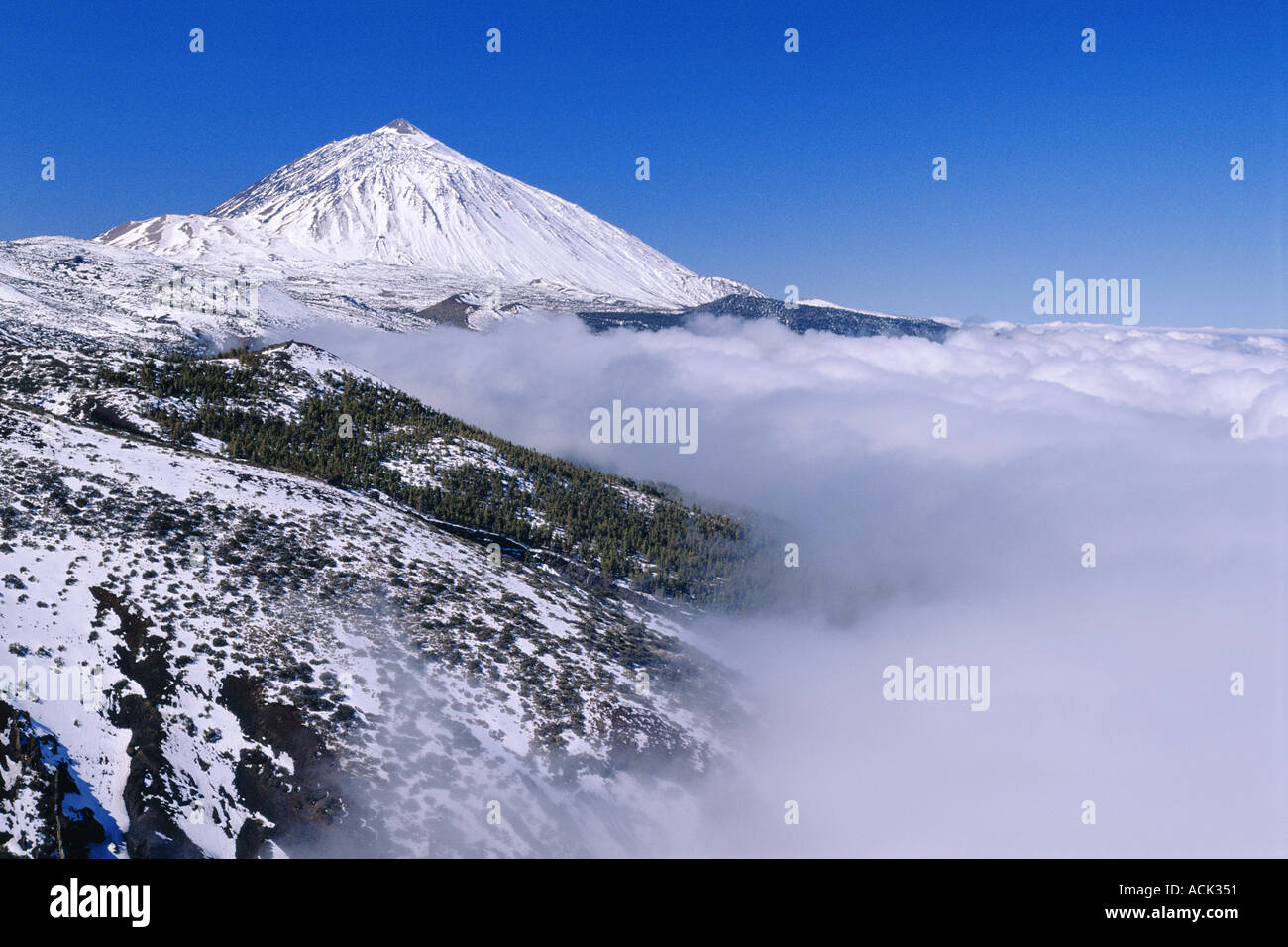Teide volcano landscape in snow and clouds Tenerife Canary Islands Spain Stock Photo