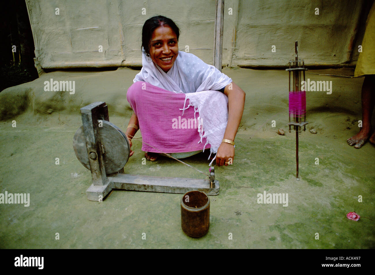 Woman spinning thread Majuli Island Assam India Stock Photo