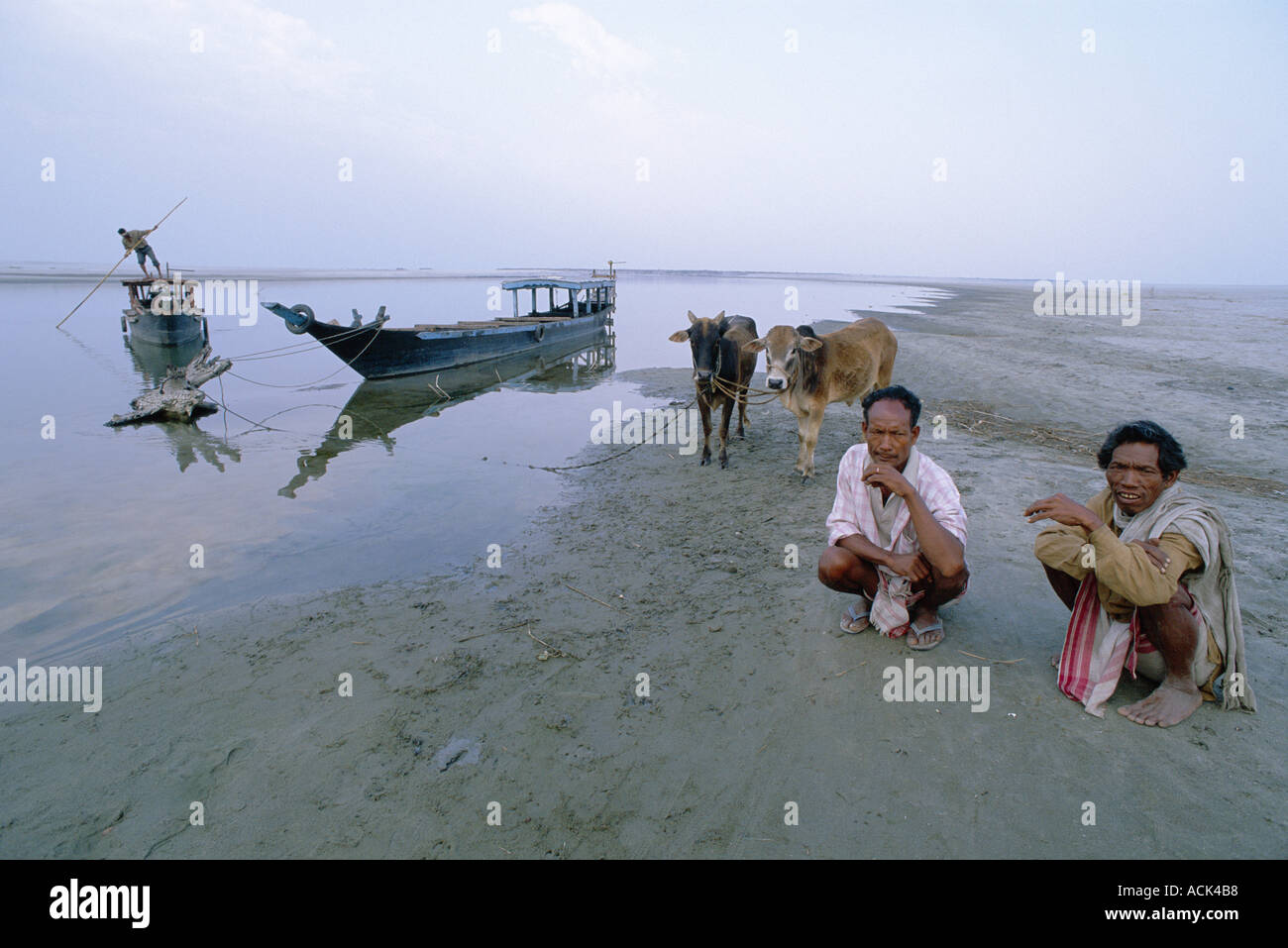 People waiting for ferry on banks of Brahmaputra river Majuli island Assam India Stock Photo