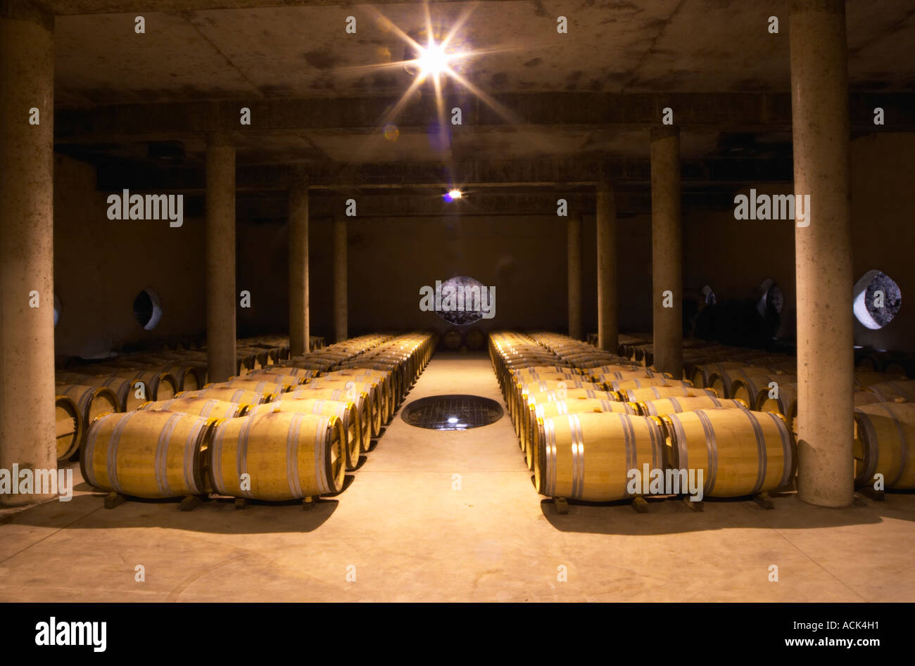 The barrel aging cellar, with a hole in the wall and a hole in the floor to show the soil and