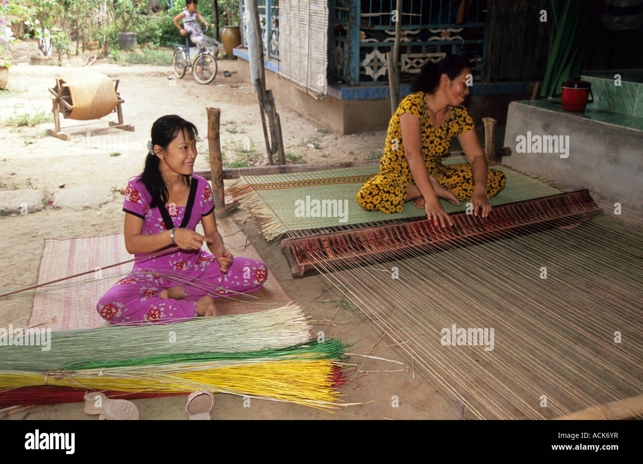 Women weaving sleeping mats, sothern Vietnam Stock Photo Alamy