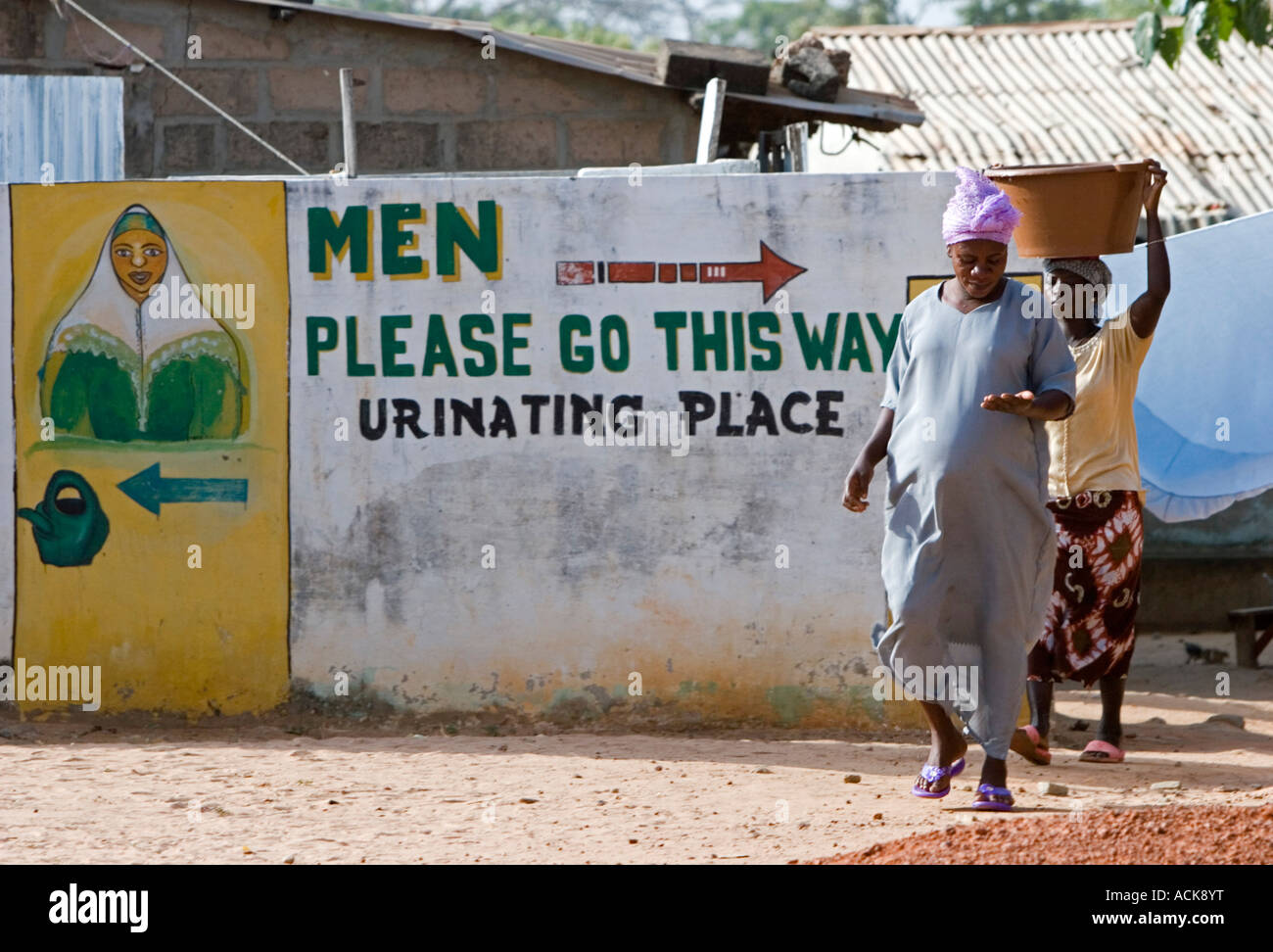 Amusing public toilets sign Brufut Ghana Town The Gambia Stock Photo