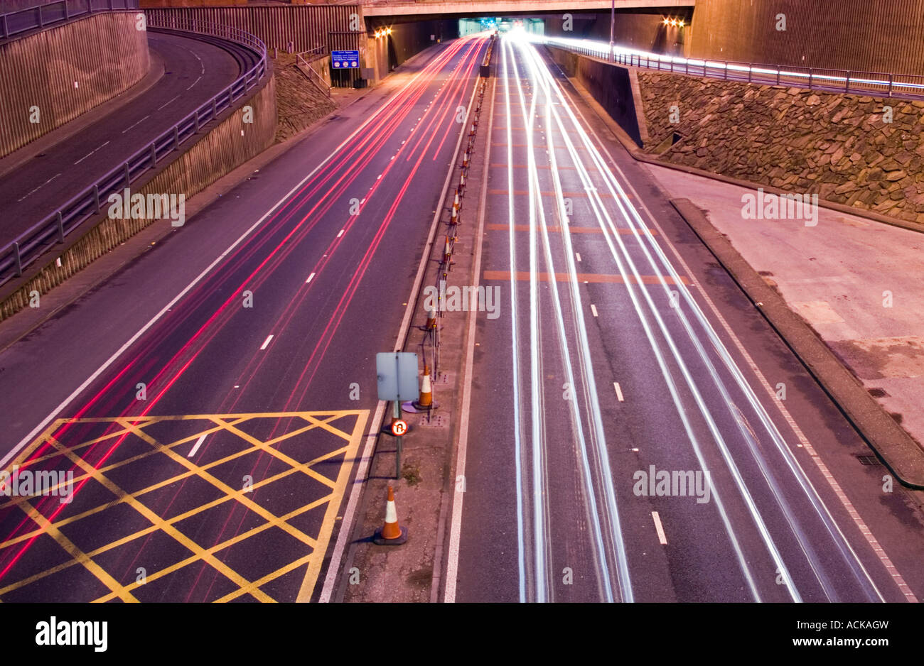 Horizontal nightime photograph of the kingsway tunnel with traffic trails Stock Photo