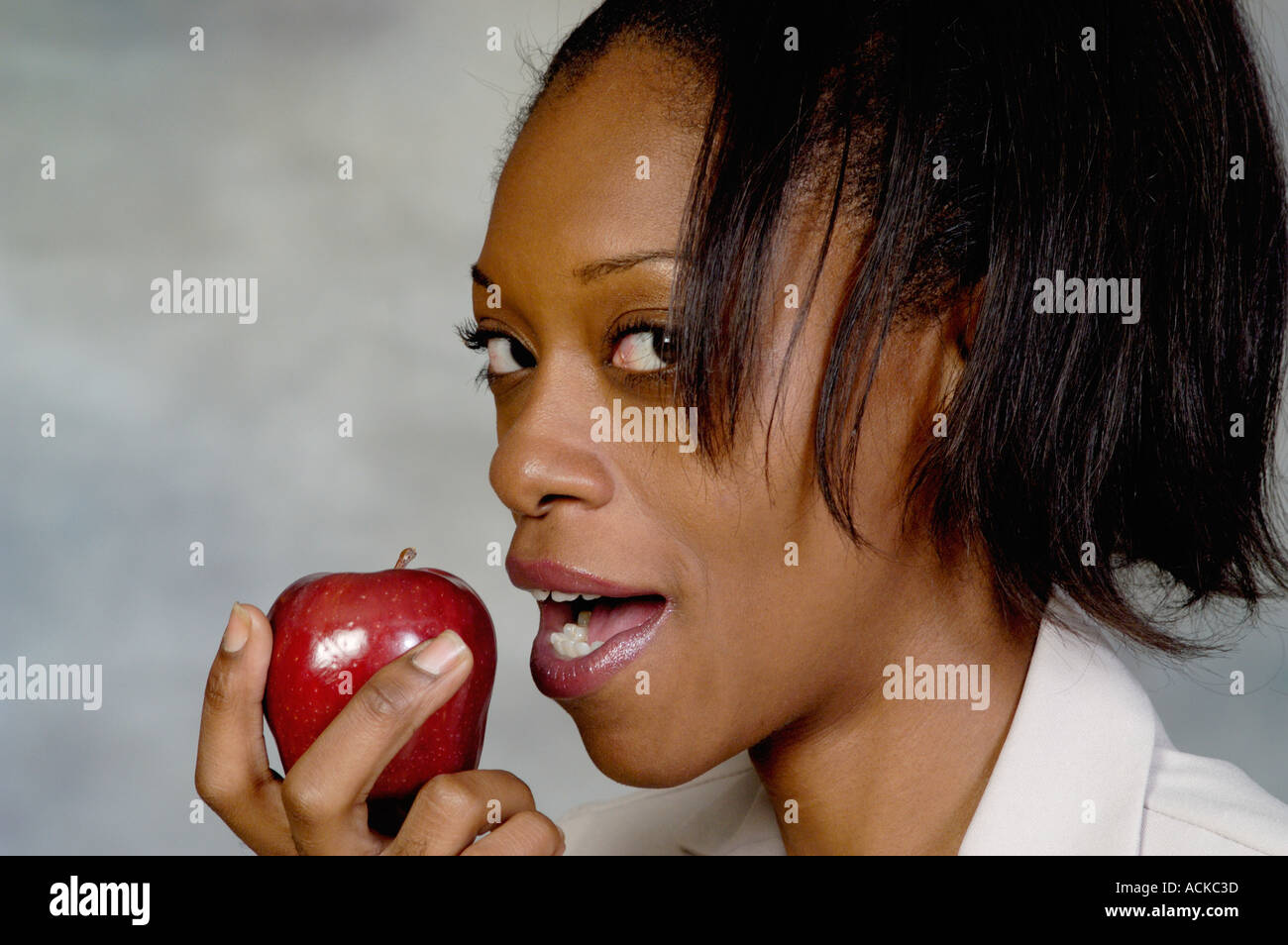 Woman holding an apple Stock Photo