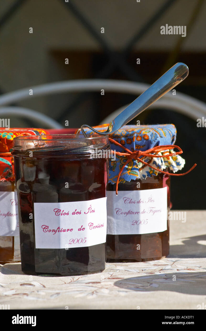 Jars pots of marmalade jam confiture of fruits and berries covered with