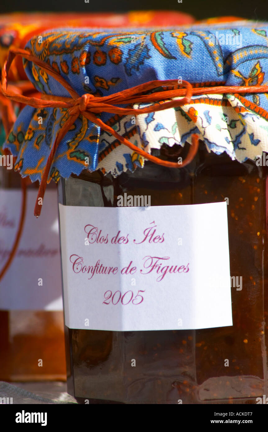 Jars pots of marmalade jam confiture of fruits and berries covered with