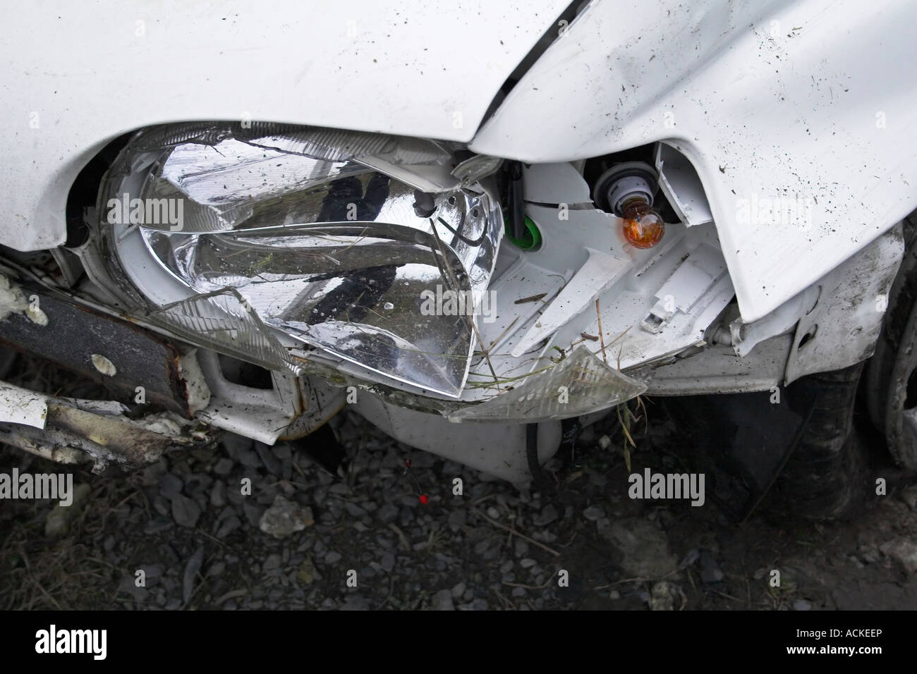 close up of a damaged headlight on car front after a car crash/accident ...