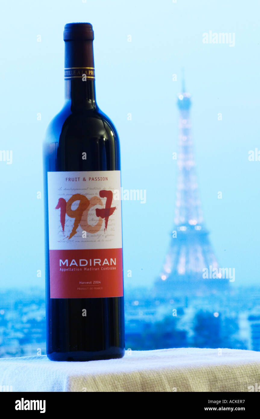 Bottle of 1907 Madiran Fruit and Passion against a pale blue background view over Paris with the Eiffel Tower Madiran France Stock Photo