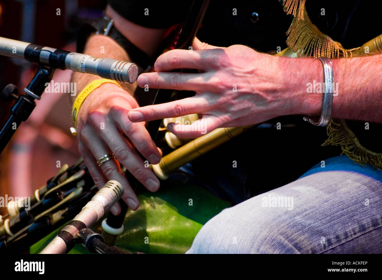 Irish traditional musician playing uilleann pipes live in concert Stock Photo