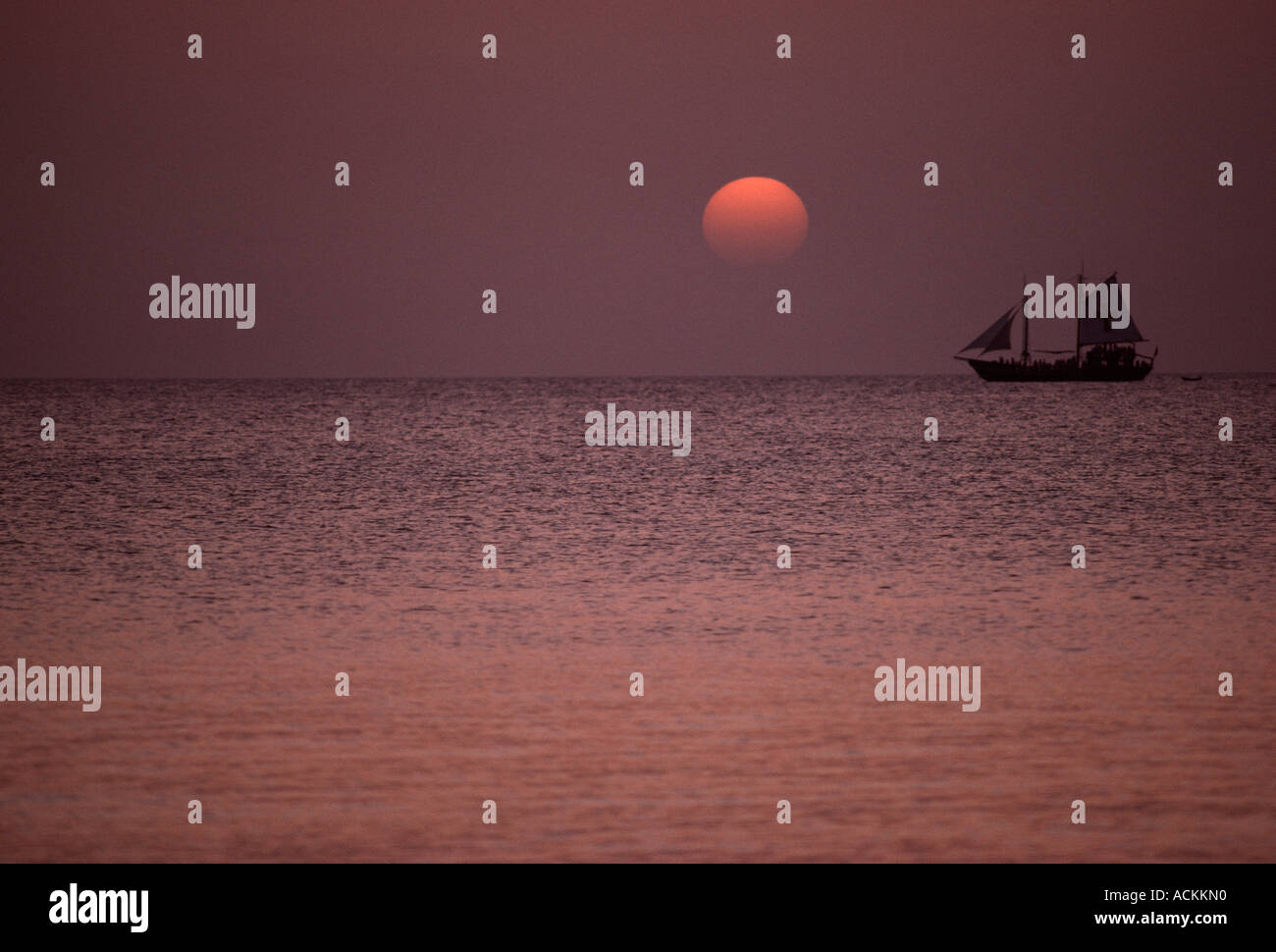 Sailing boat at sunset hi-res stock photography and images - Alamy