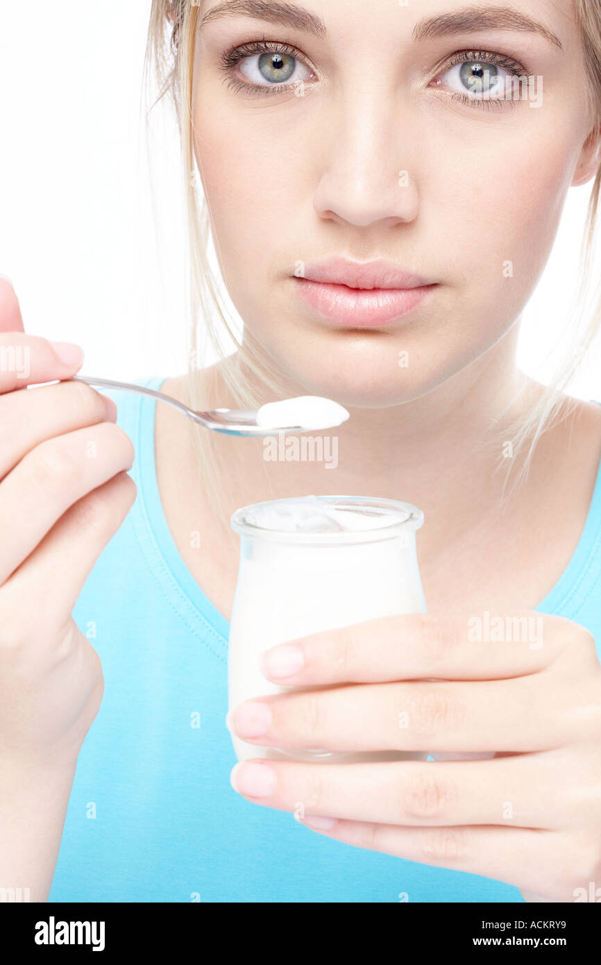 Woman eating yogurt blue hires stock photography and images Alamy