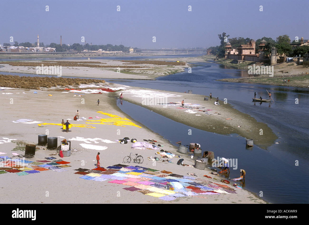 Laundry spread out to dry in the hot sunshine on the sandy banks of the Yamuna River Agra Uttar Pradesh India Stock Photo