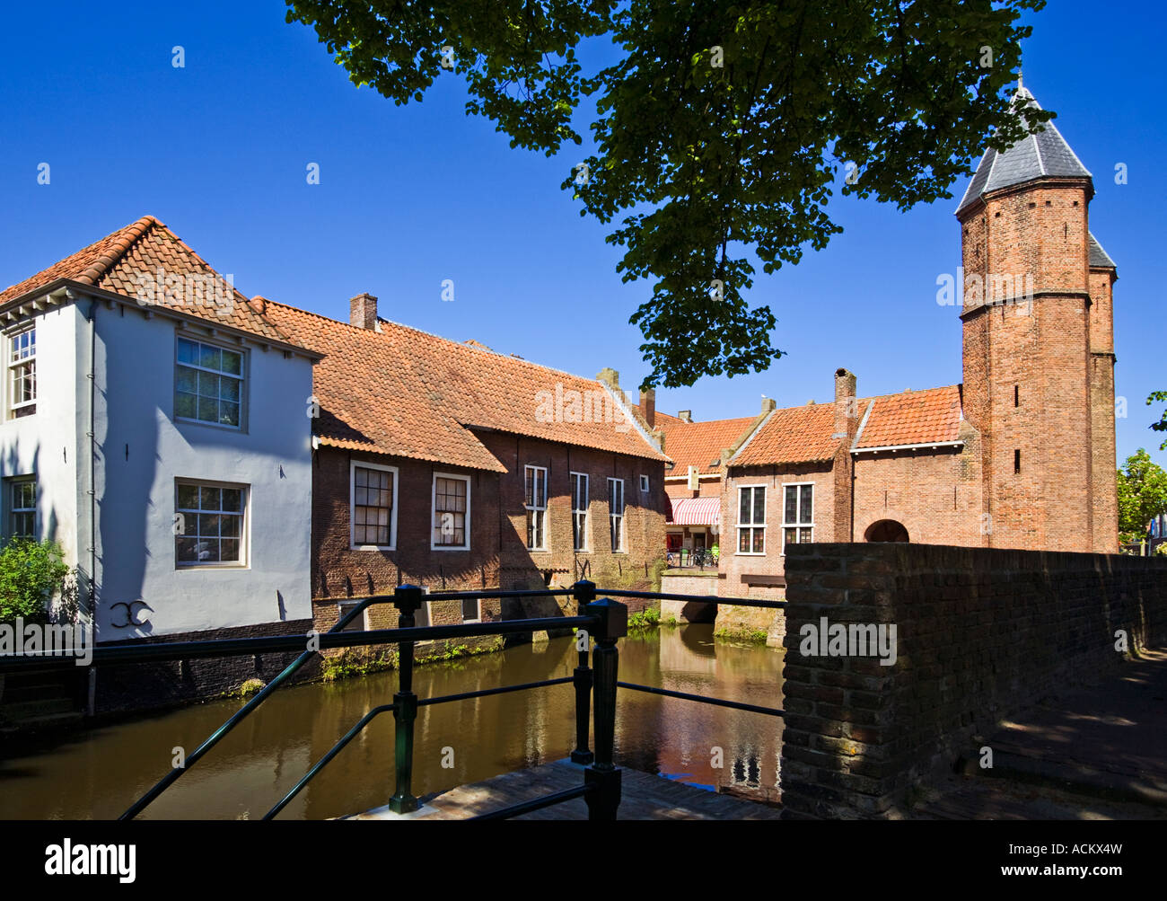 Amersfoort, Holland - The Kamperbinnenpoort and Muurhuizen or wall houses on the canal in the old city Stock Photo