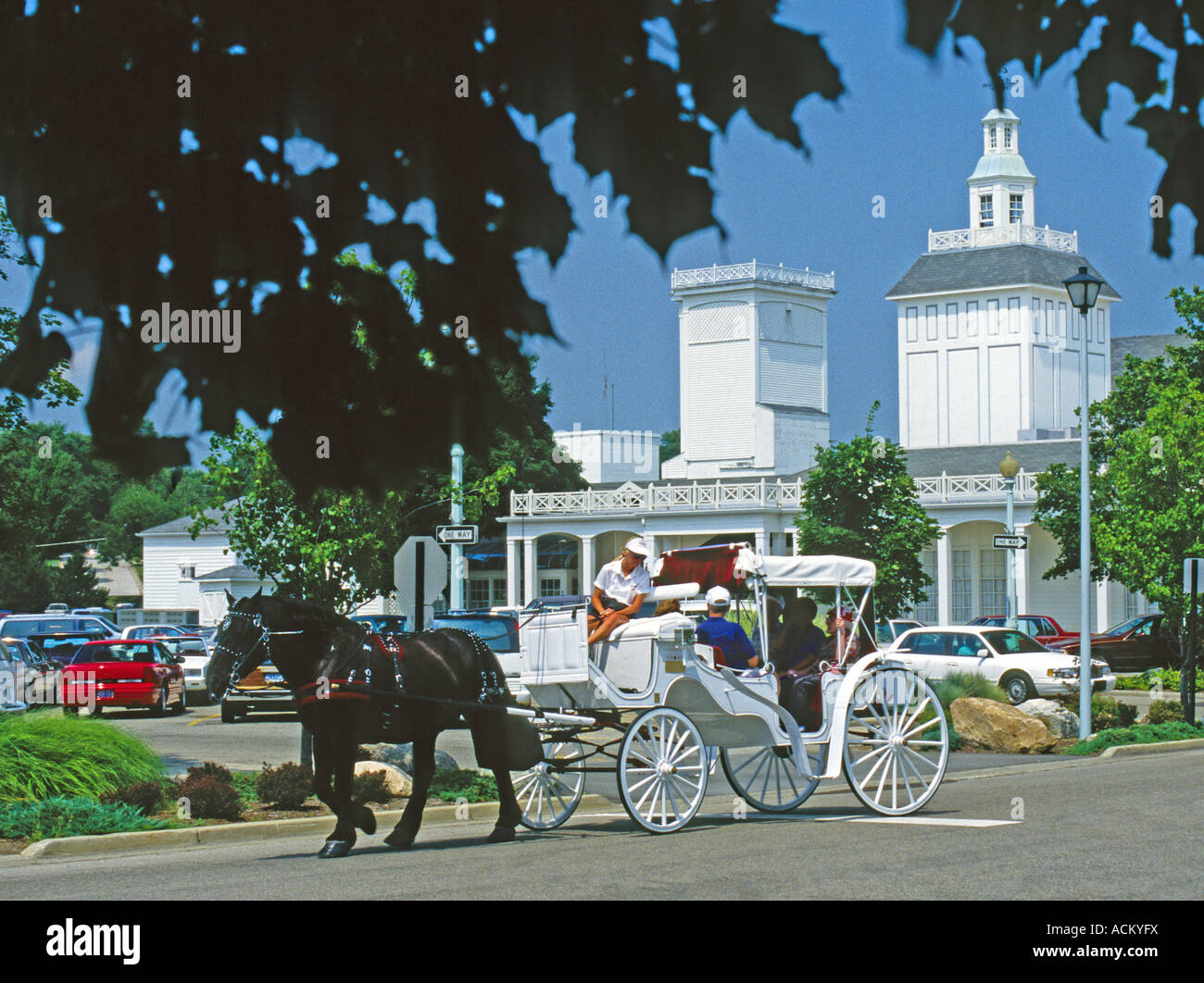 Horse drawn carriage passing Zehnder's Restaurant, famous for fried
