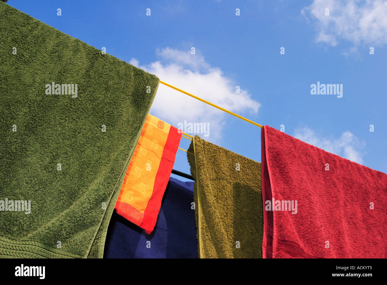 Brightly colored washing on a clothes line Stock Photo