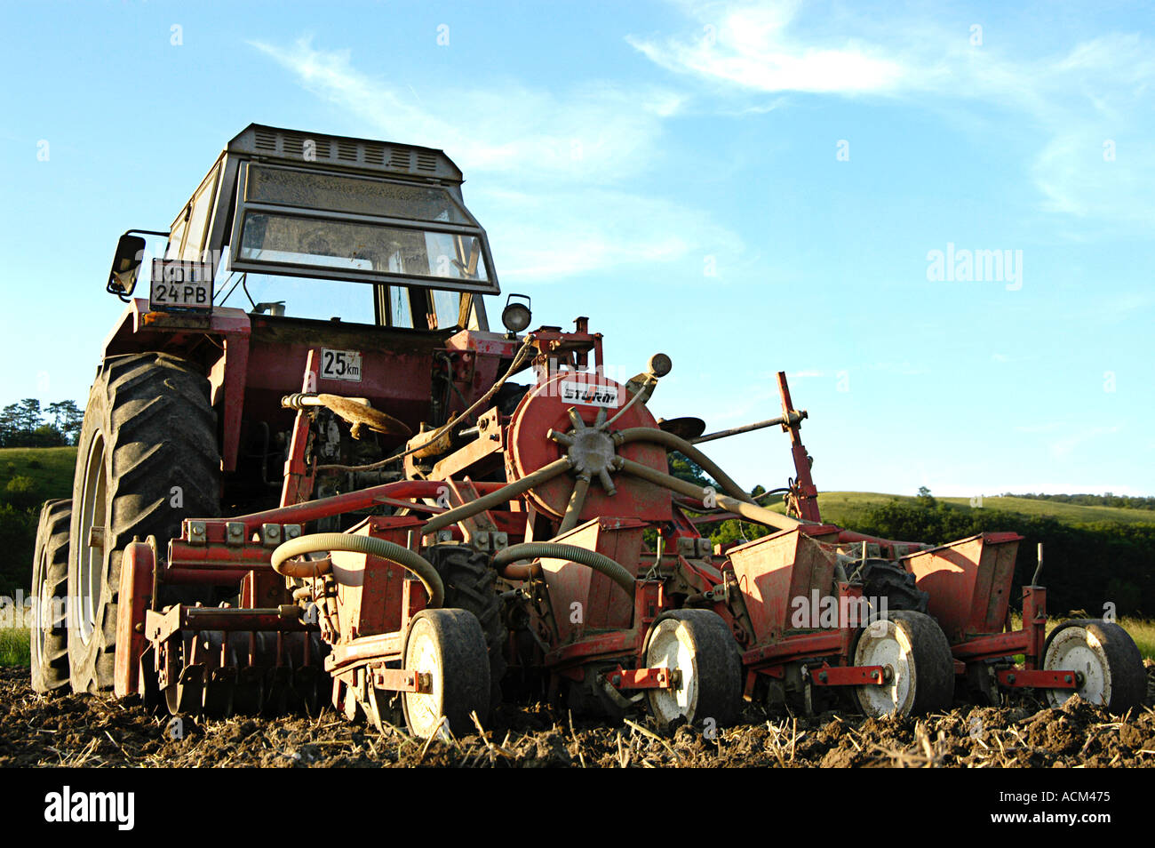 A Tractor plowing a field Tractor with a plow Stock Photo - Alamy