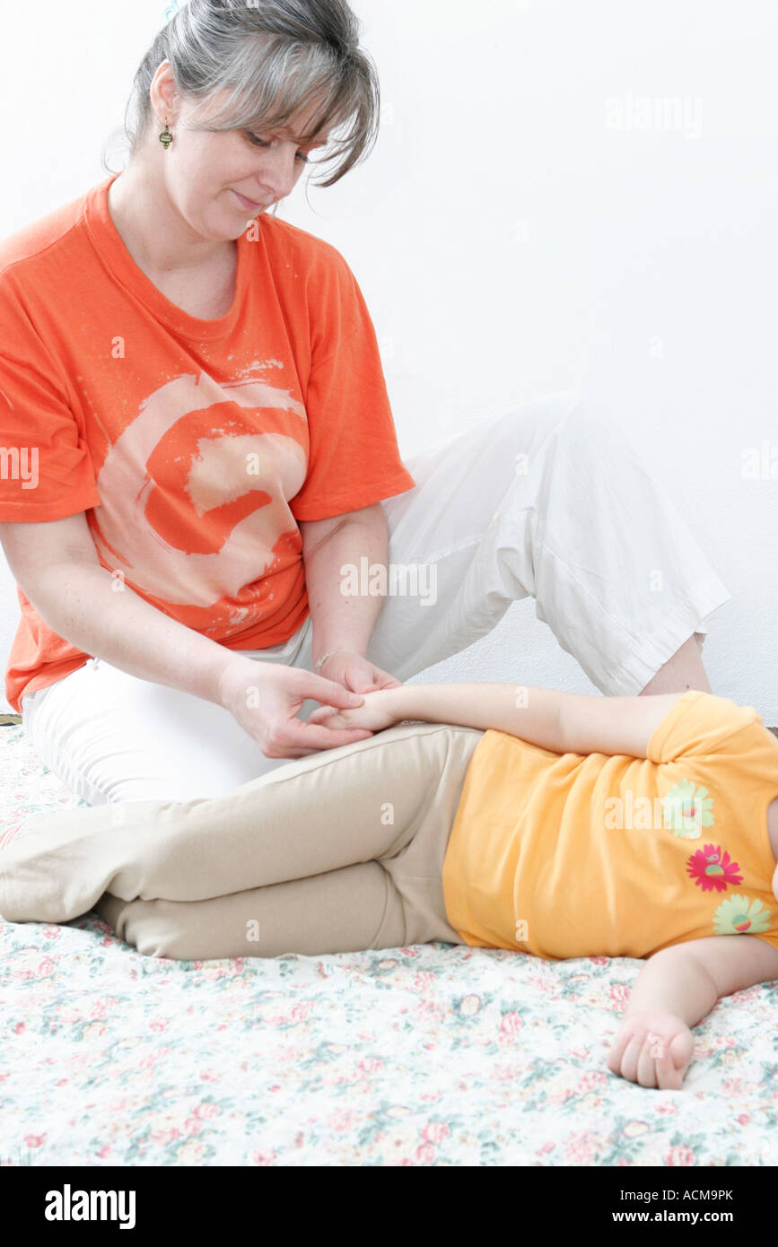 Shiatsu massage practise on child Stock Photo - Alamy