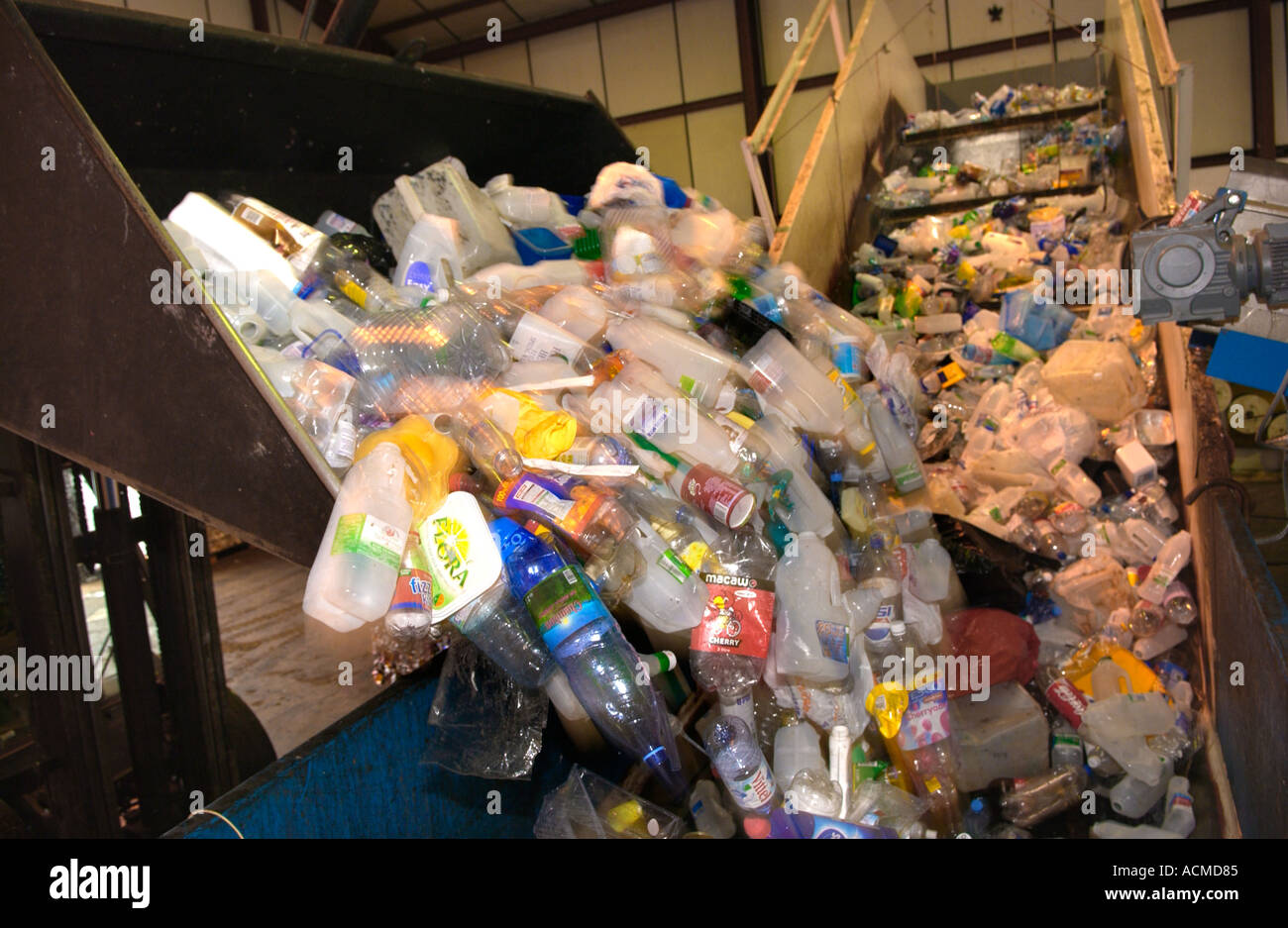 Plastic items collected and being baled by Wastesavers community recycling group from households in Newport South Wales Gwent UK Stock Photo