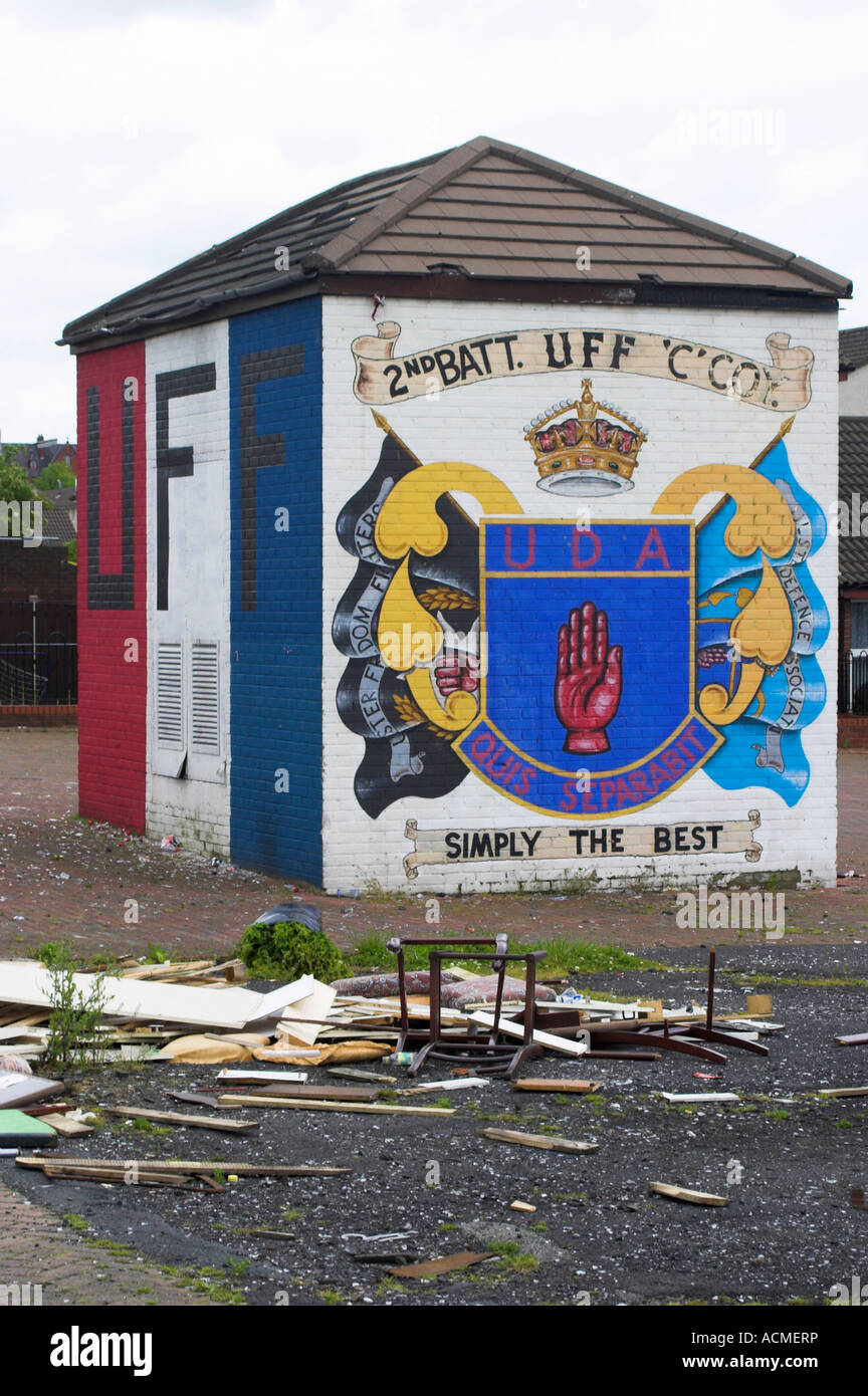 Two Murals UFF colours and UDA emblem and UDA and UFF flags Shankill Road Belfast Belfast County Antrim Northern Ireland Stock Photo