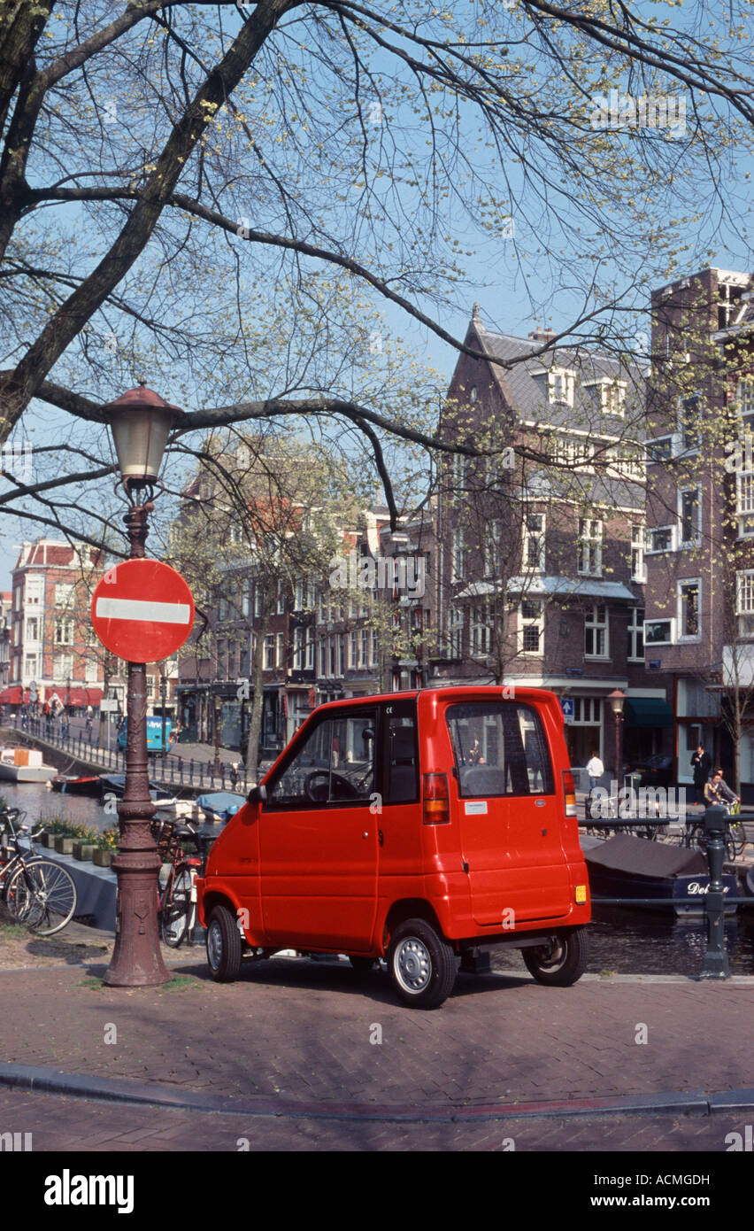 Canta LX environmentally friendly microcar parked on a bridge in Amsterdam, Netherlands, Europe. Stock Photo