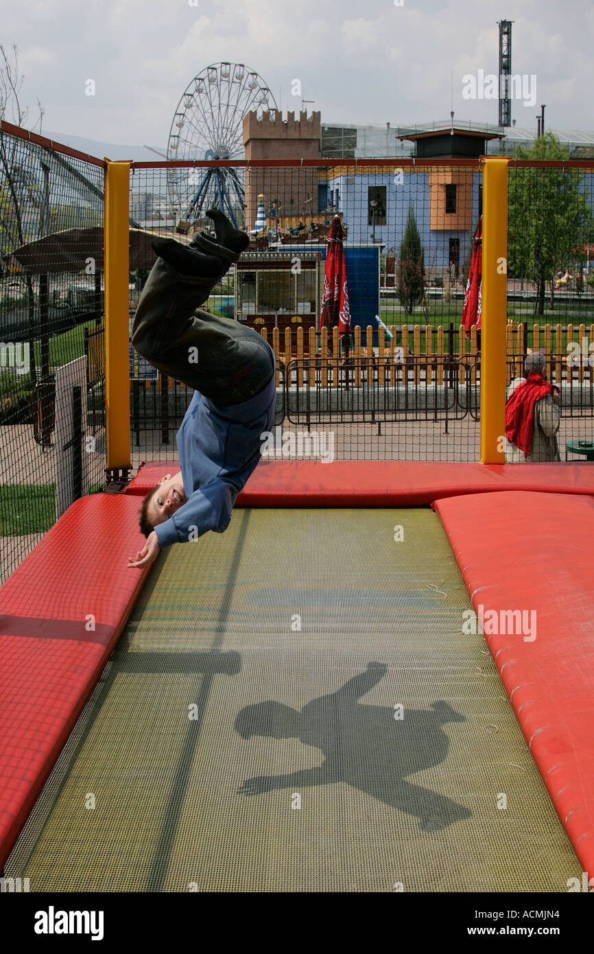 kid child playing on trampoline jumping bounce children plunge board ...