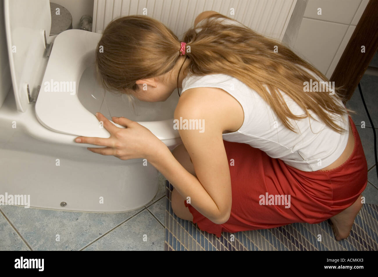 Woman Vomiting Into Toilet Stock Photos & Woman Vomiting 