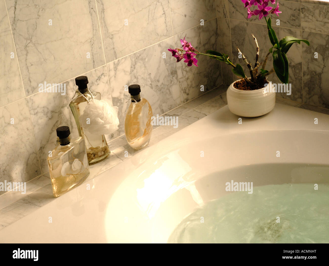 Bath oils by tub Stock Photo Alamy