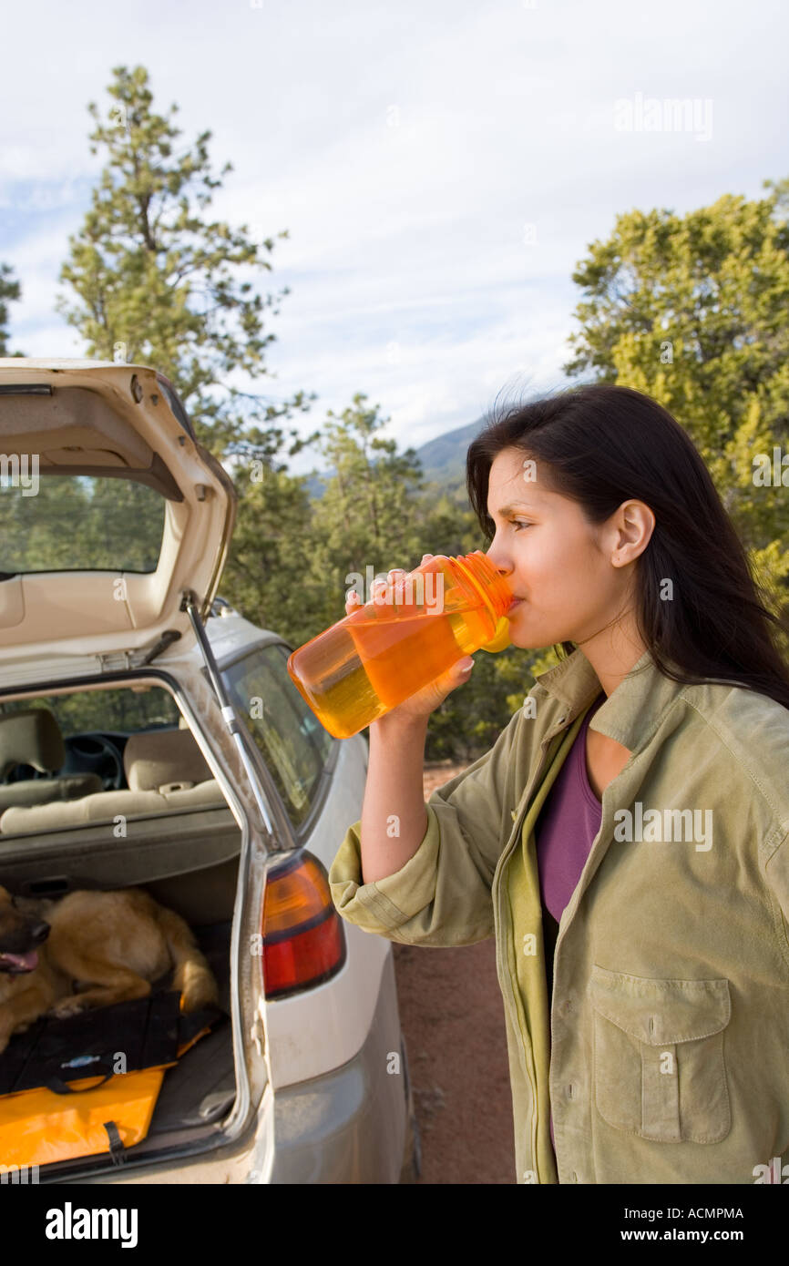 young woman with her shepard on nature trail Stock Photo