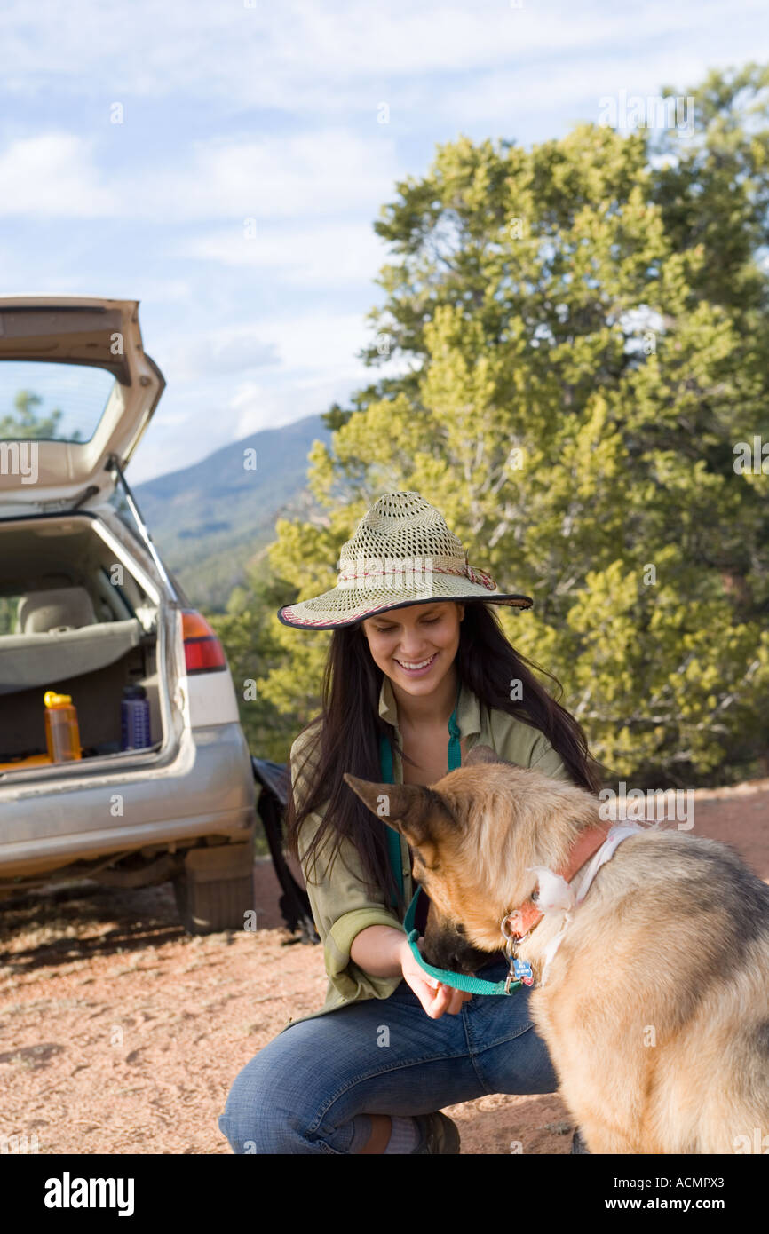 young woman with her shepard on nature trail Stock Photo