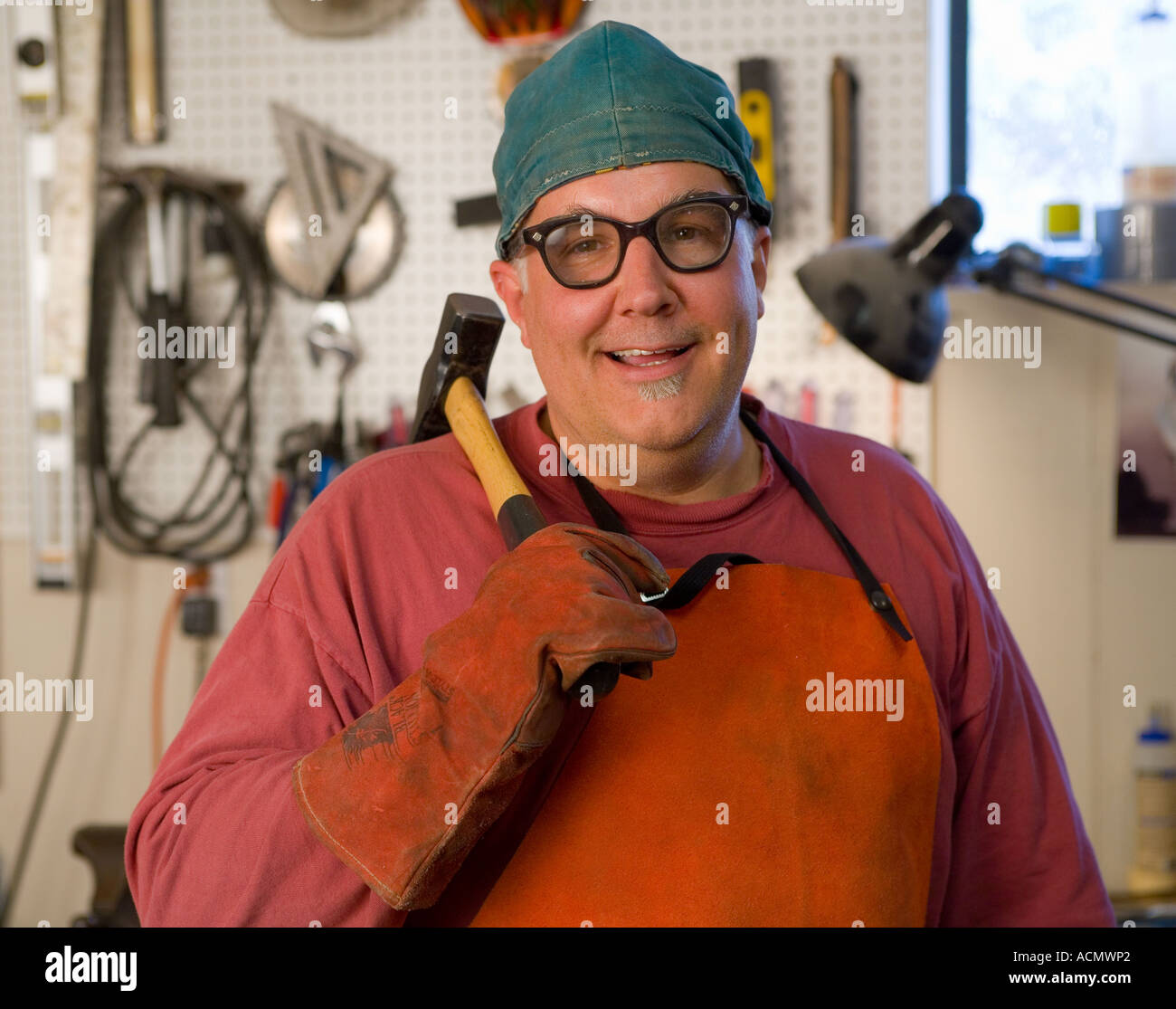 metal fabricator,blacksmith in his studio Stock Photo