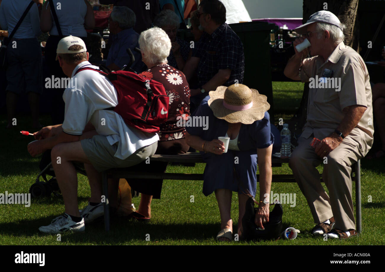 People sitting at country fair Norwich Norfolk Stock Photo