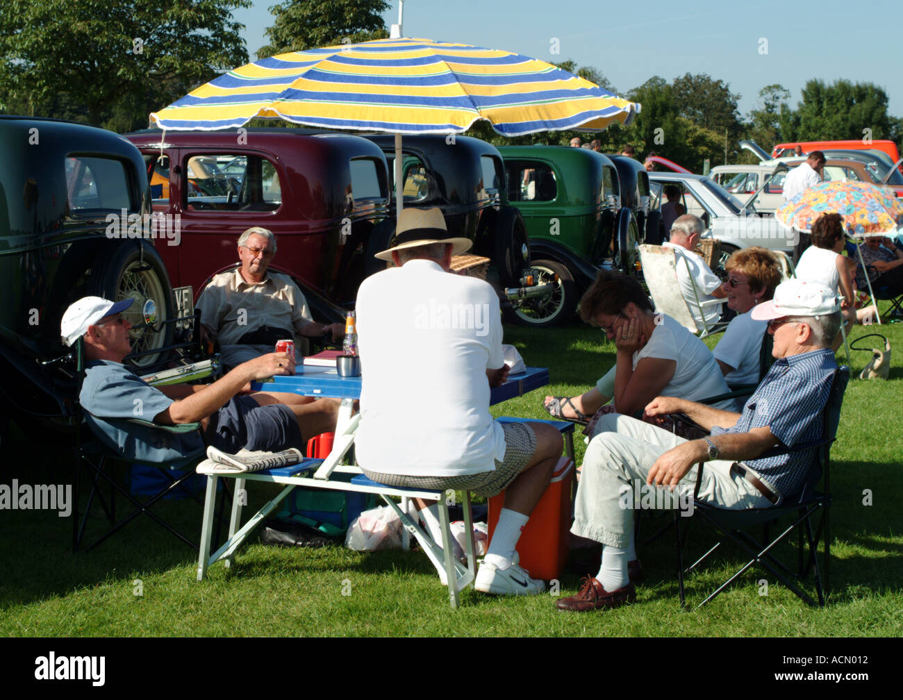 People sitting at country fair Norwich Norfolk Stock Photo