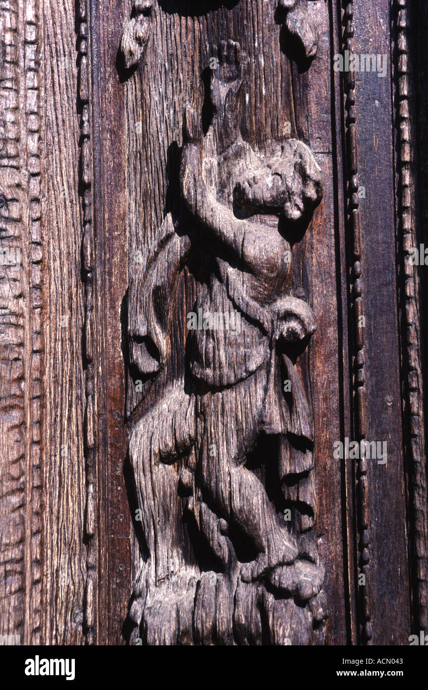 Carved wooden figure in door surround Duomo Todi Umbria Italy Stock Photo