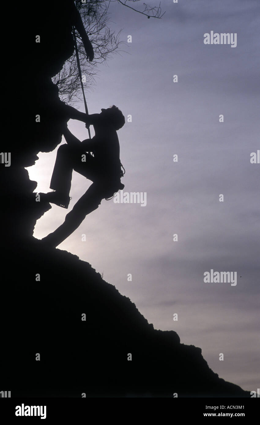climber silhouetted, photo by Bruce Miller Stock Photo