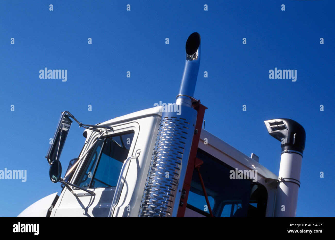 truck cabin and chrome exhaust,  and sky, photo by Bruce Miller Stock Photo