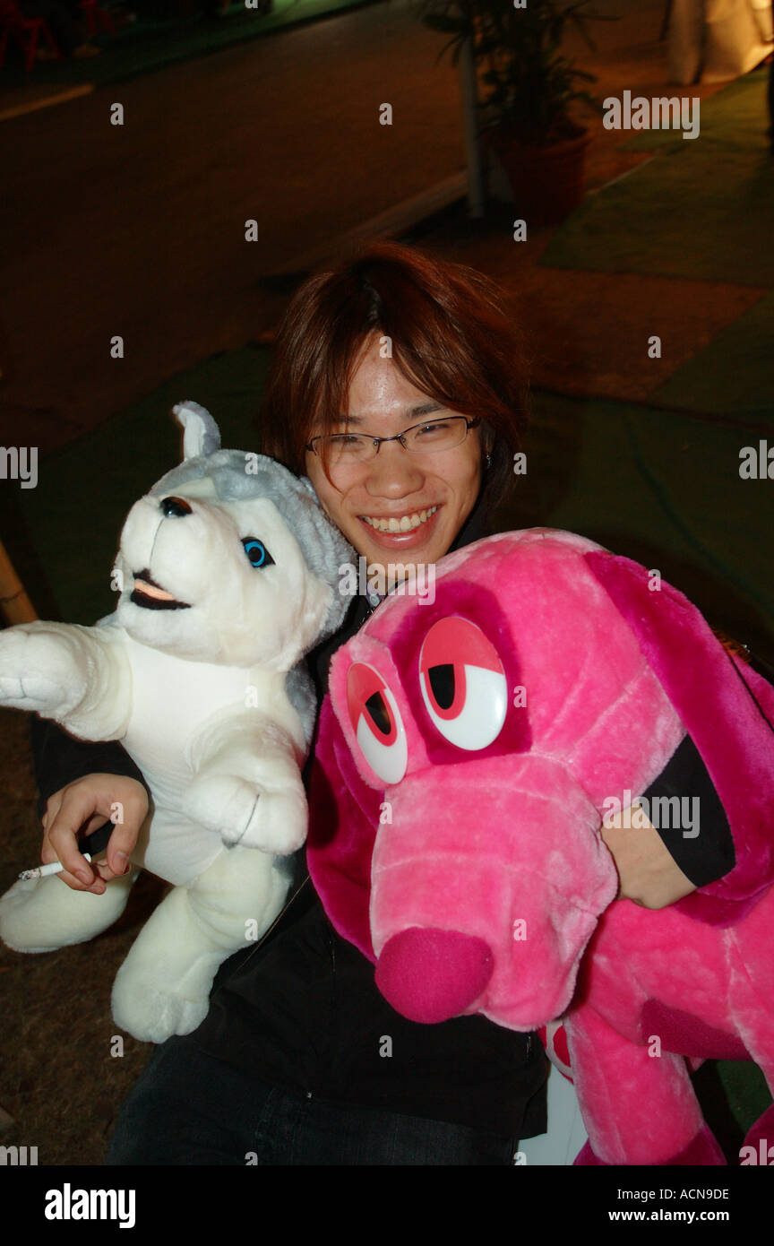 young smiling asian with soft toy prize at show dsc 2186 Stock Photo ...