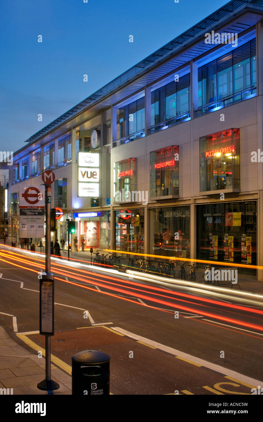 Dusk view of the Fulham Broadway shopping centre on Fulham road in London. Stock Photo