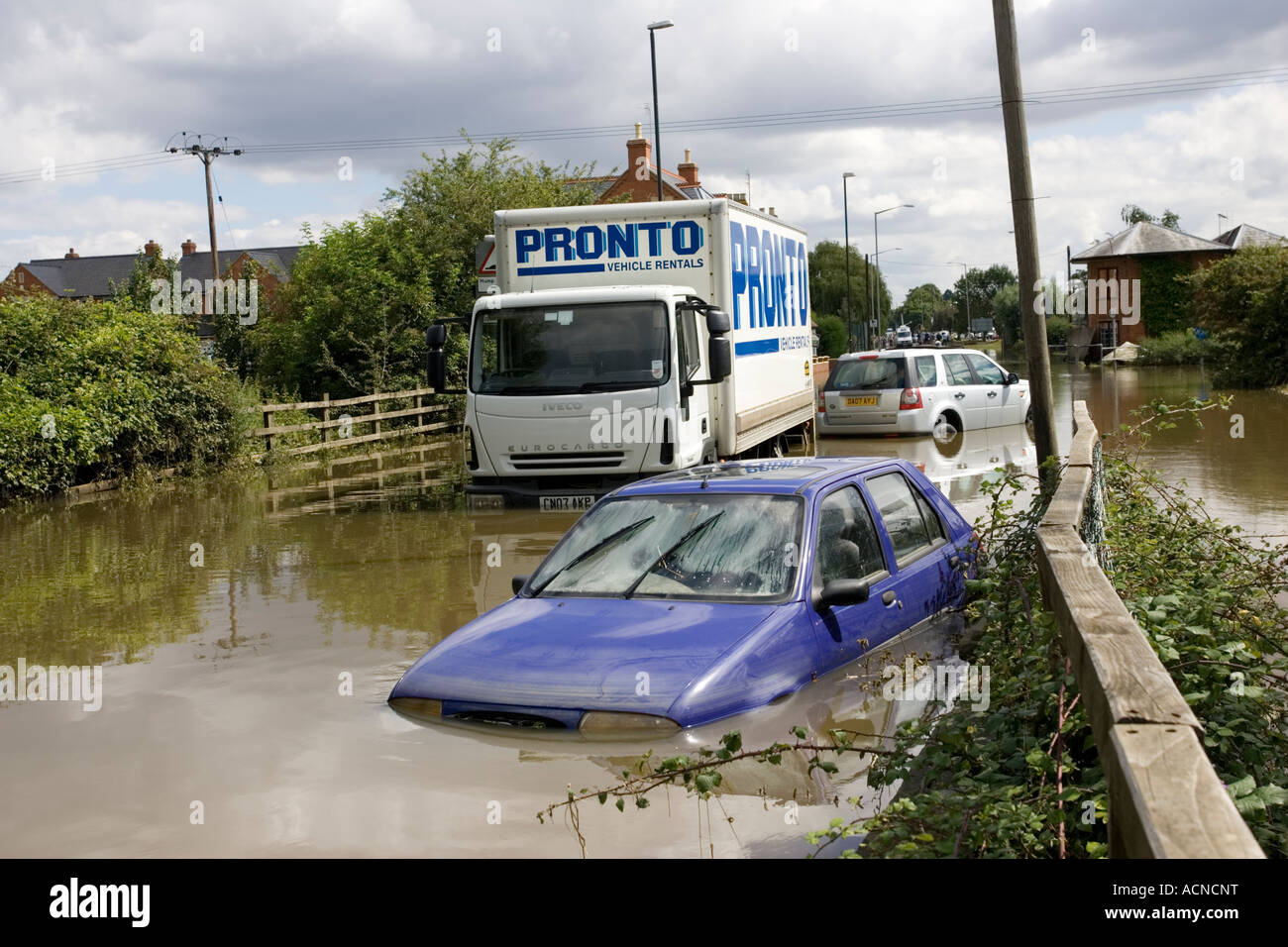 Cars and lorries partly submerged on flooded road into Newtown Tewkesbury Gloucestershire UK July 2007 Stock Photo