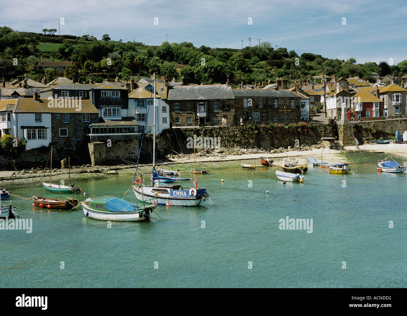 Fishing boats in the harbour at Mousehole village near Penzance in West Cornwall in the UK Stock Photo