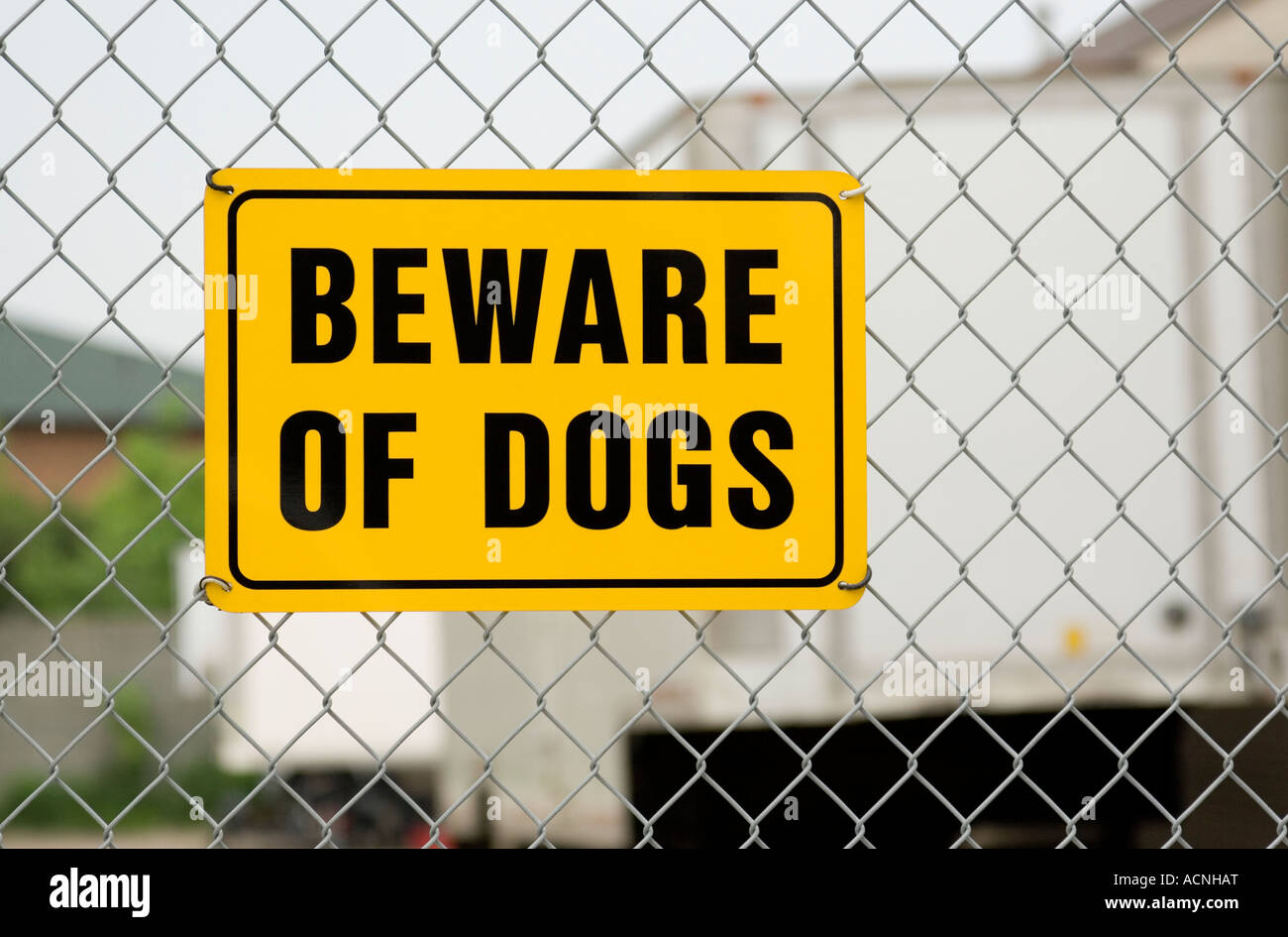 Beware of Dogs sign on chain link fence Stock Photo