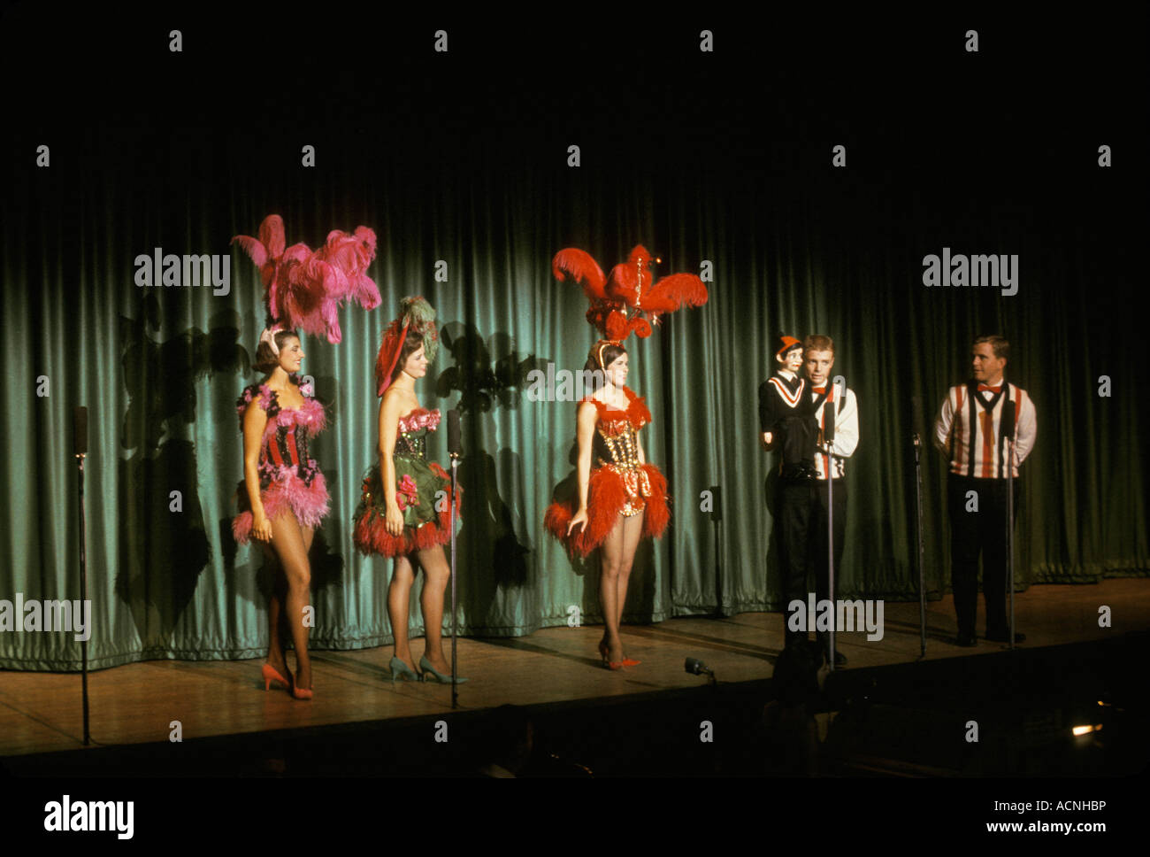 Six Flags over Texas stage show performers showgirl ventriloquist feathered costumes Six Flags over Texas USA America South Stock Photo