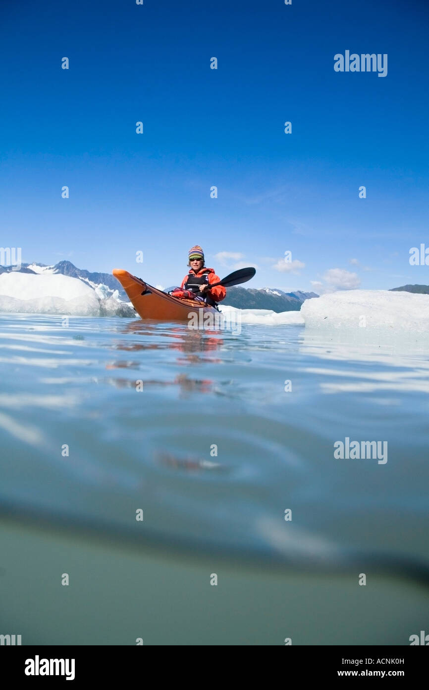 Female kayaker in Bear Cove Lagoon Resurrection Bay Alaska Kenai Fjords NP Kenai Peninsula