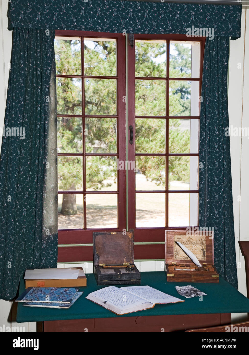 Writing journal and quill pen on table in front of window Fort Langley Canada Stock Photo